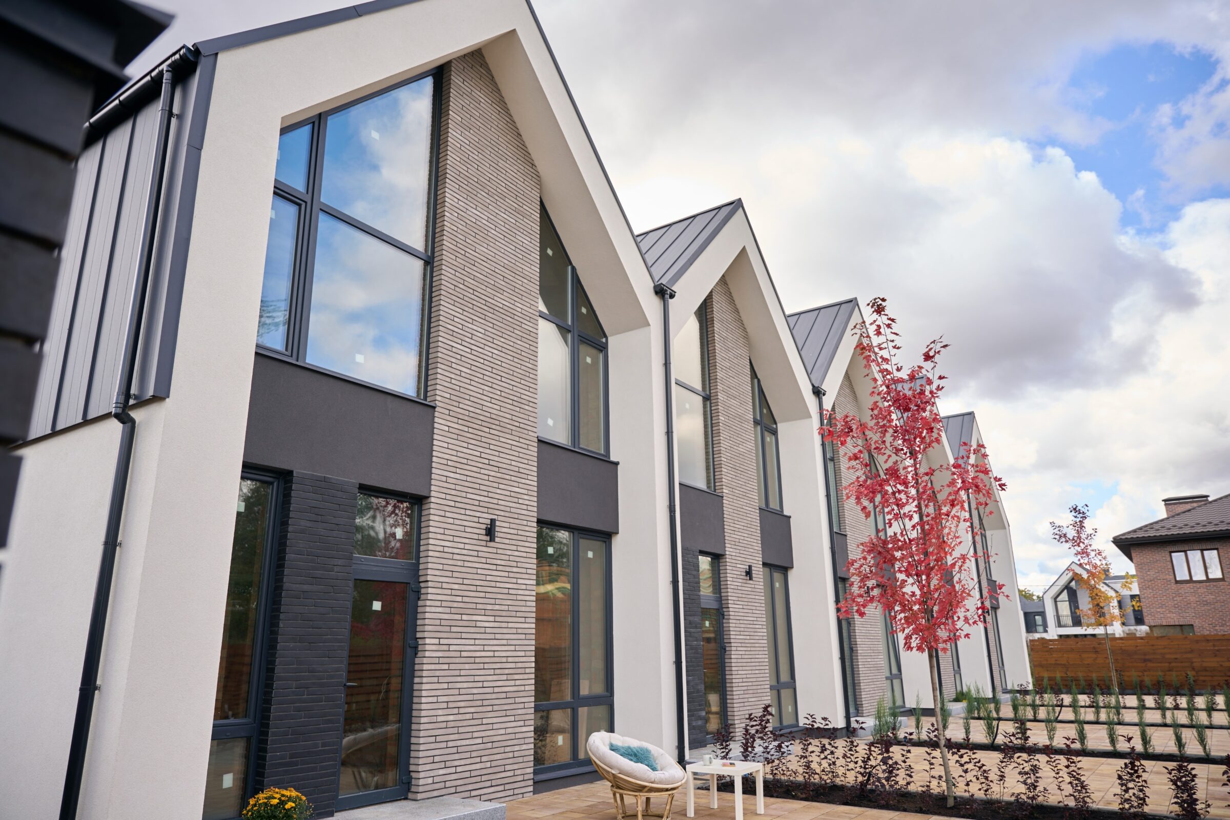 Contemporary townhouses standing in line in reside
